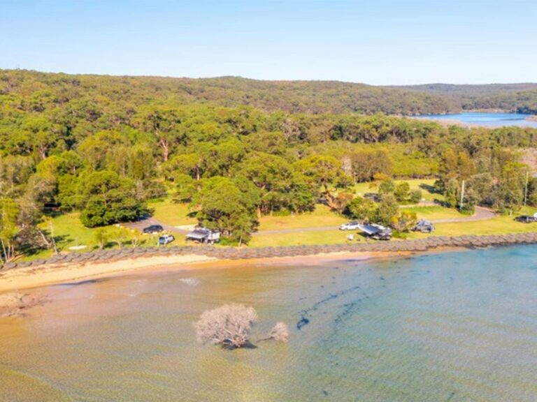 An aerial view of Bonnie Vale campground, river and sand spit in Royal National Park. Photo: Andrew