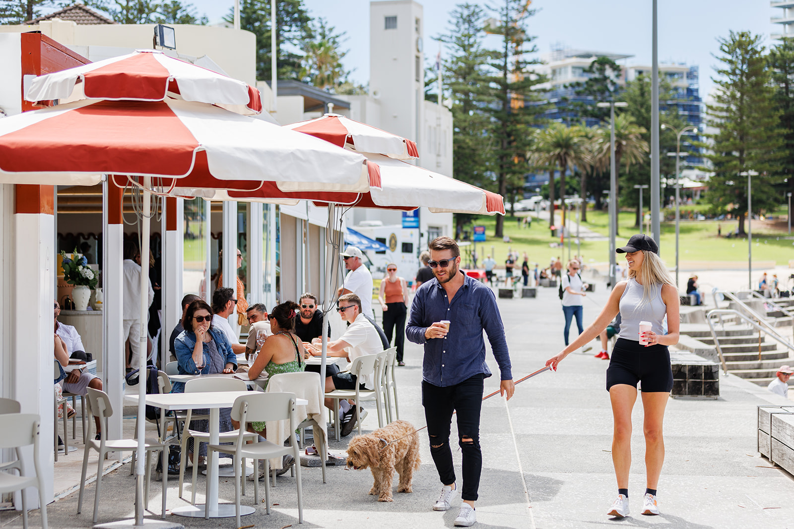 Couple walking inf front of Bobbys Cronulla