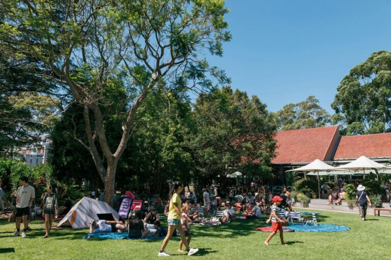 People sitting in gardens at open day event