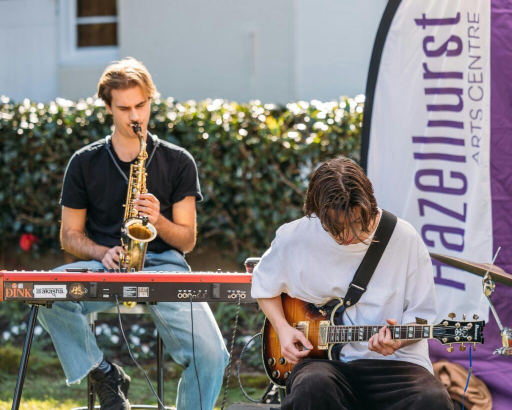 A band playing outdoors at Hazelhurst Arts Centre