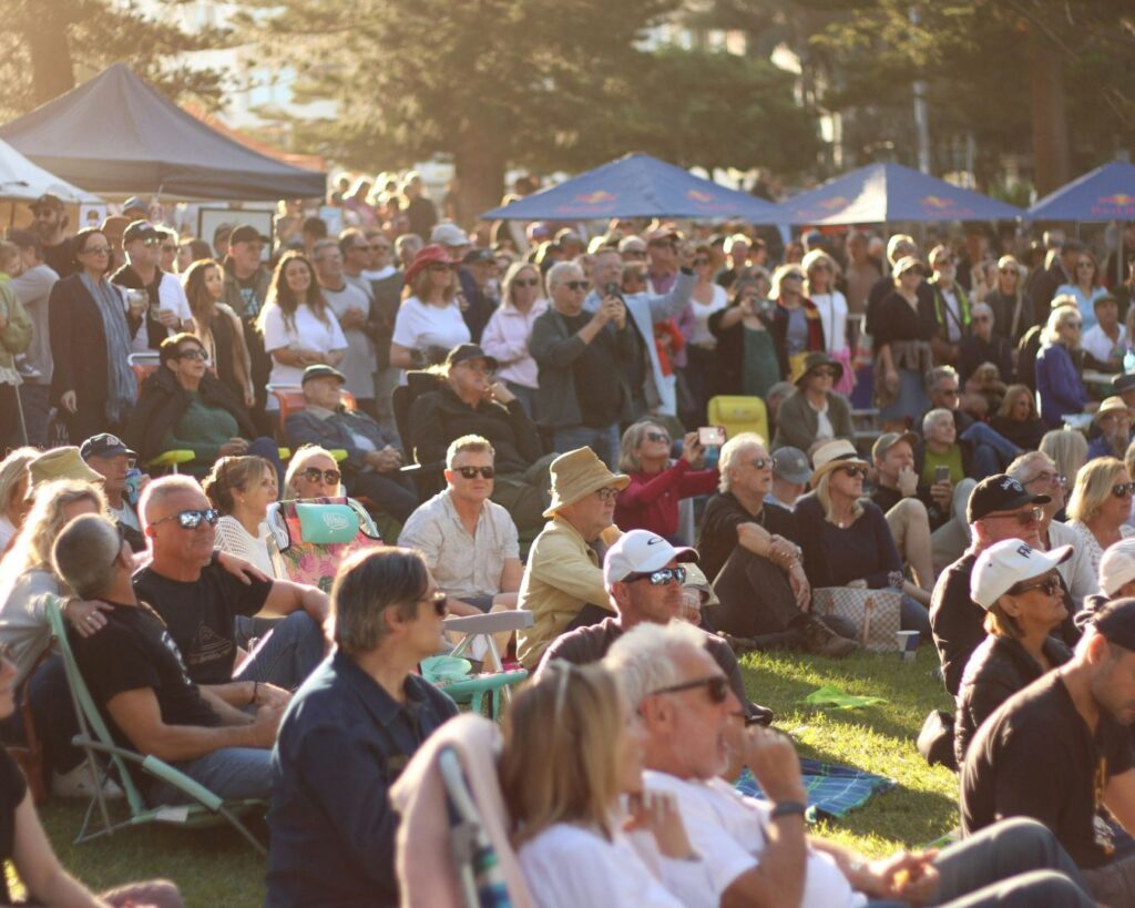 A crowd sitting down outdoors