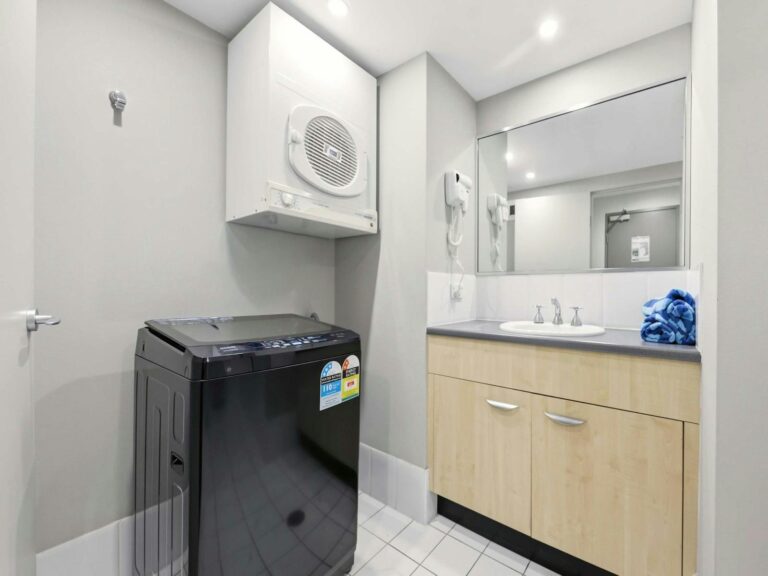 Laundry area with washer