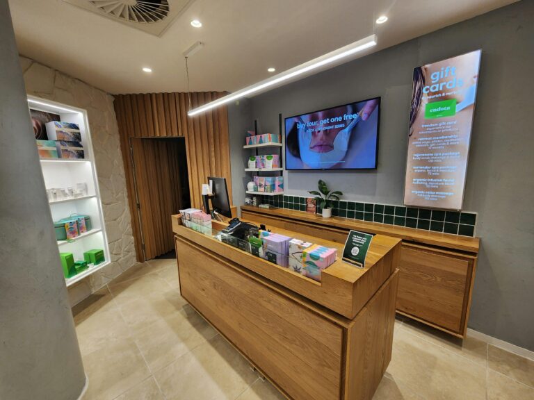 Spa reception area with a welcoming timber door eading to the relaxation lounge
